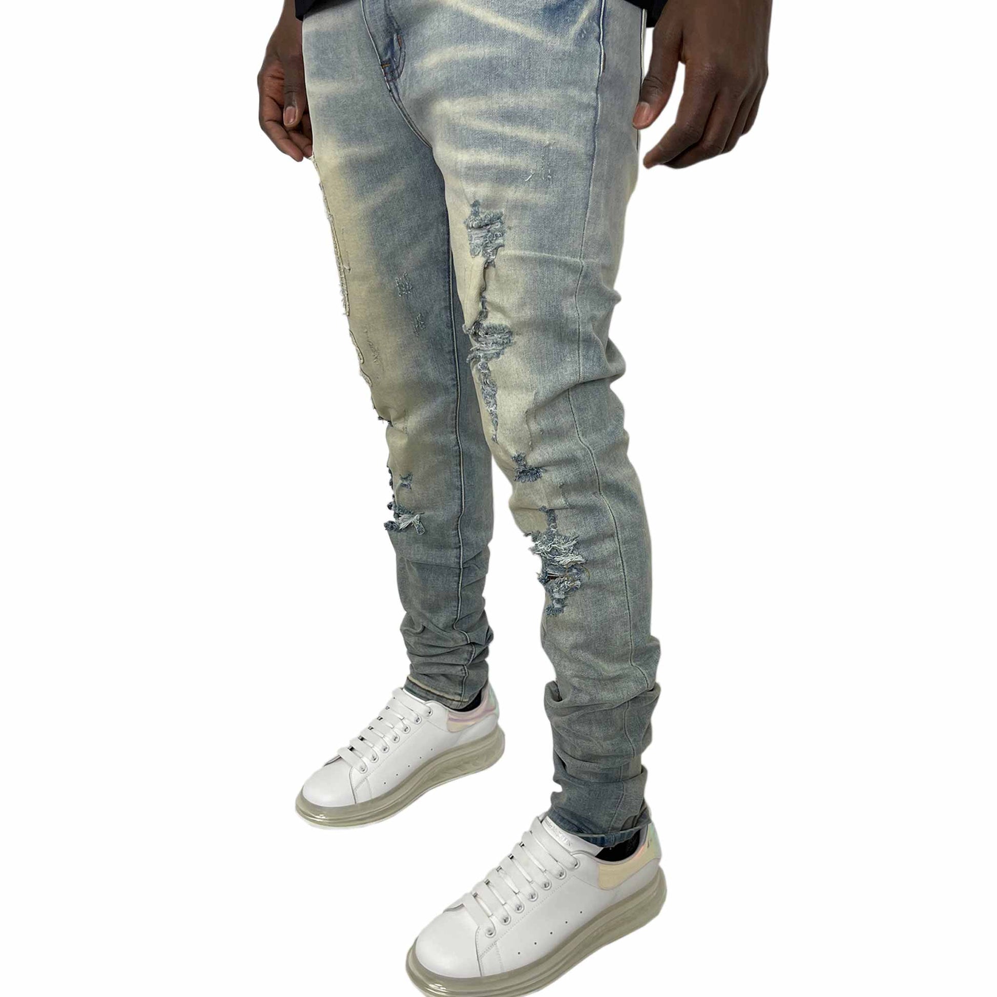 Distanced stance of Jeans with a side profile