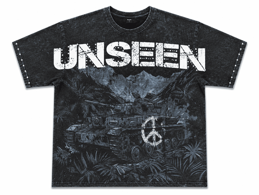 A black acid-wash graphic t-shirt featuring the word 'UNSEEN' in distressed white letters across the chest, with a graphic of military tanks and a peace sign below, displayed on a solid white background.