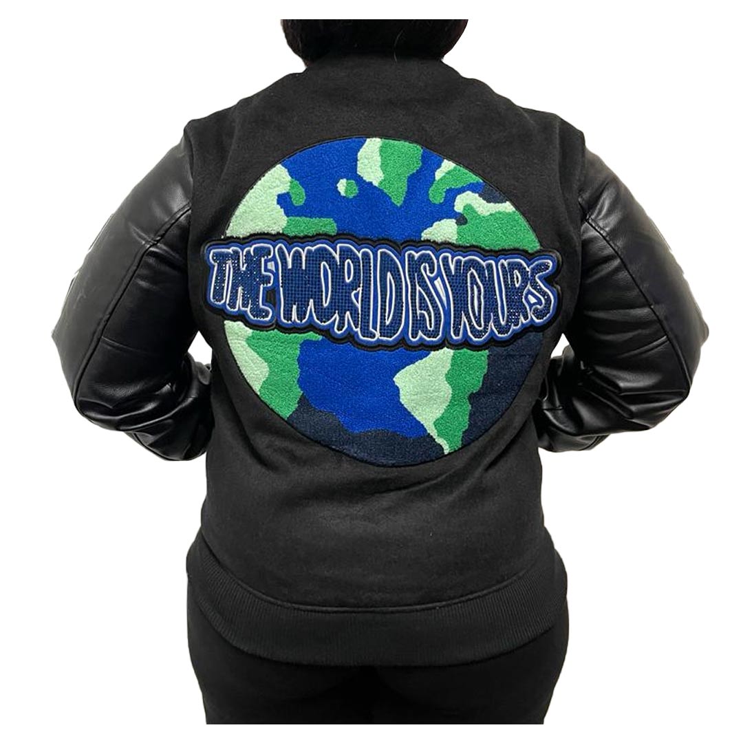 Back of jacket includes chenille earth in blue and green with writing "the world is yours" in blue rhinestones.