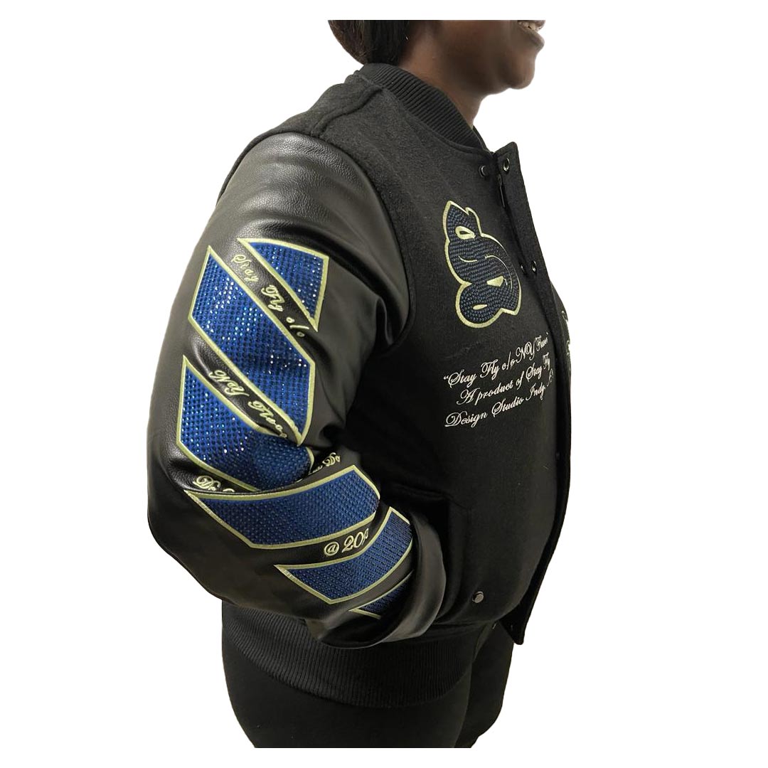 Right side profile of jacket has blue rhinestones on sleave in a halve chevron pattern outlined in lime green.